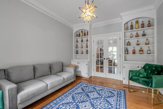 2245 Abbeywood Rd, Lexington, KY 40515 - living area featuring french doors, built in shelves, wood finished floors, and ornamental molding