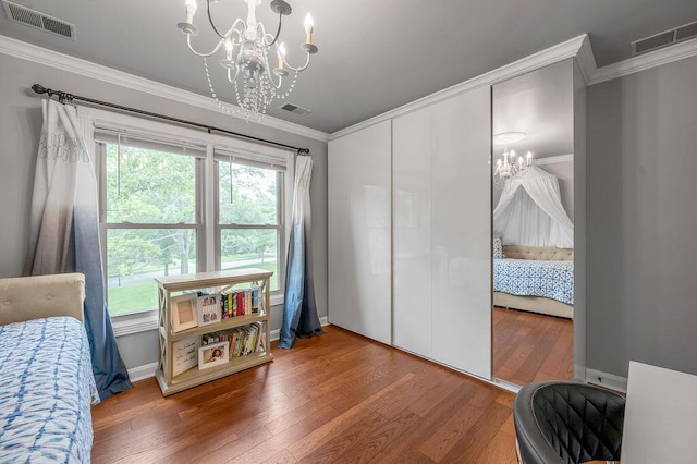 2245 Abbeywood Rd, Lexington, KY 40515 - bedroom featuring a chandelier, wood finished floors, ornamental molding, and baseboards
