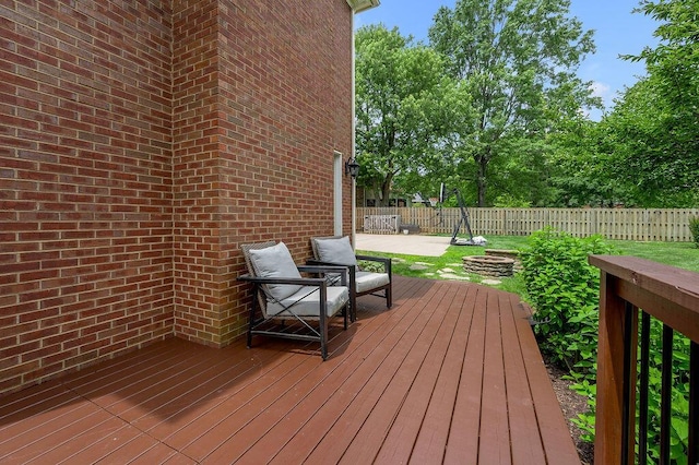 2245 Abbeywood Rd, Lexington, KY 40515 - deck featuring a fire pit and a fenced backyard