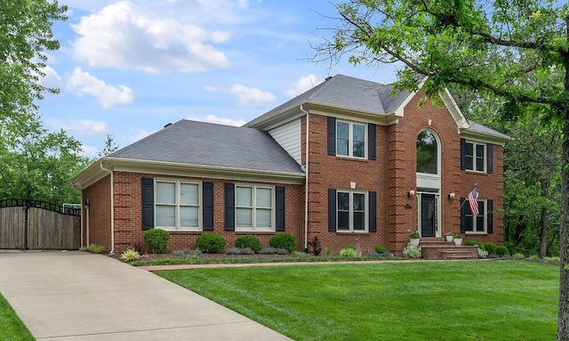 2245 Abbeywood Rd, Lexington, KY 40515 - view of front of home featuring a gate, brick siding, and a front lawn