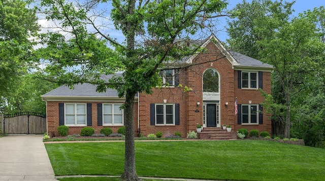2245 Abbeywood Rd, Lexington, KY 40515 - colonial home with a gate, brick siding, a front lawn, and driveway