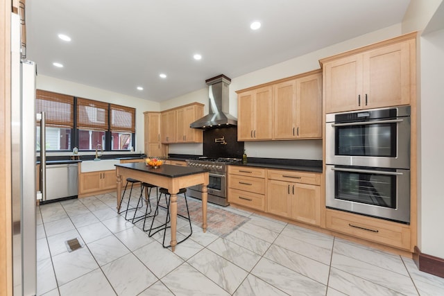 105 E 4th St, Augusta, KY 41002 - kitchen with wall chimney exhaust hood, stainless steel appliances, light brown cabinetry, light marble finish flooring, and recessed lighting
