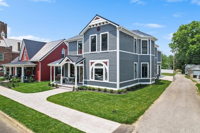 105 E 4th St, Augusta, KY 41002 - victorian house with a front lawn and covered porch