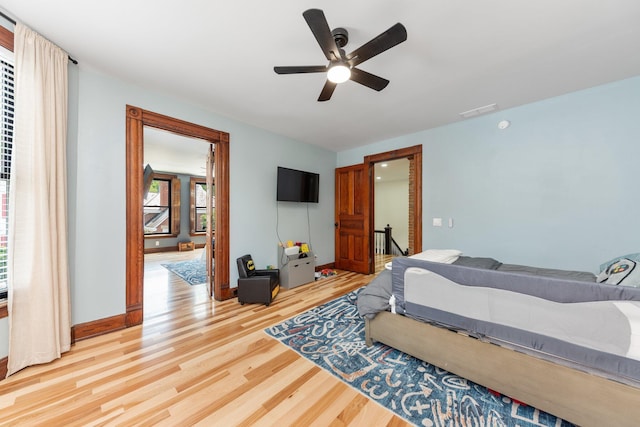 105 E 4th St, Augusta, KY 41002 - bedroom with light wood-style flooring, a ceiling fan, and baseboards
