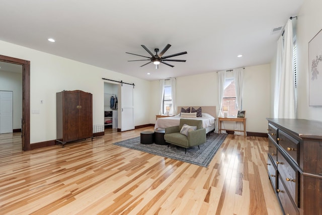 105 E 4th St, Augusta, KY 41002 - bedroom with a barn door, light wood-style floors, baseboards, recessed lighting, and ceiling fan