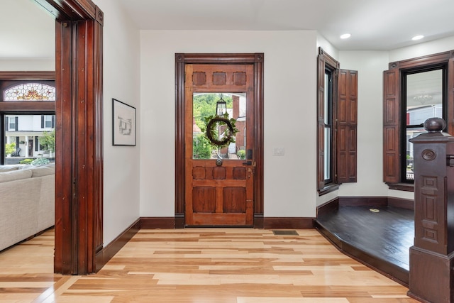 105 E 4th St, Augusta, KY 41002 - entryway with light wood-type flooring, healthy amount of natural light, baseboards, and recessed lighting