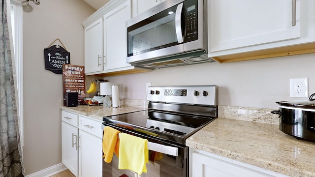 345 Memory Ln, Richmond, KY 40475 - kitchen featuring appliances with stainless steel finishes, white cabinets, and light stone counters