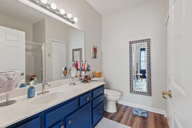 196 Academy Dr, Wilmore, KY 40390 - bathroom with vanity, a shower with shower door, wood finished floors, toilet, and baseboards