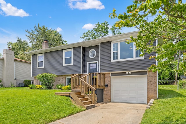263 S Eagle Creek Dr, Lexington, KY 40515 - raised ranch with brick siding, a garage, a chimney, driveway, and cooling unit