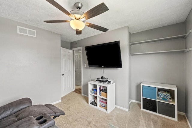 263 S Eagle Creek Dr, Lexington, KY 40515 - carpeted living area with a ceiling fan, a textured ceiling, and baseboards