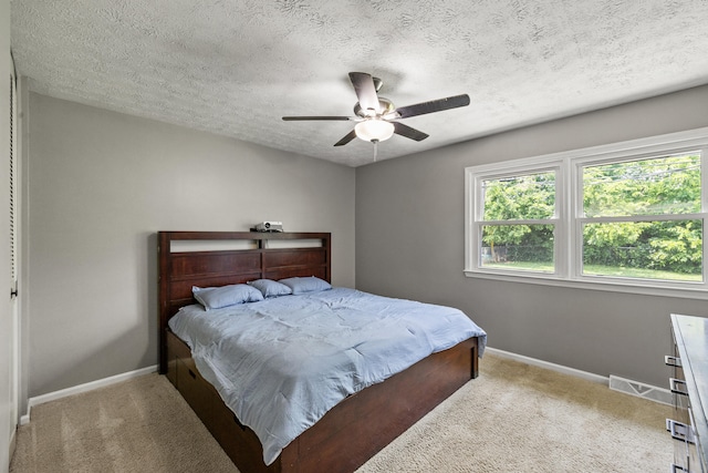 263 S Eagle Creek Dr, Lexington, KY 40515 - bedroom with light colored carpet, baseboards, a textured ceiling, and ceiling fan