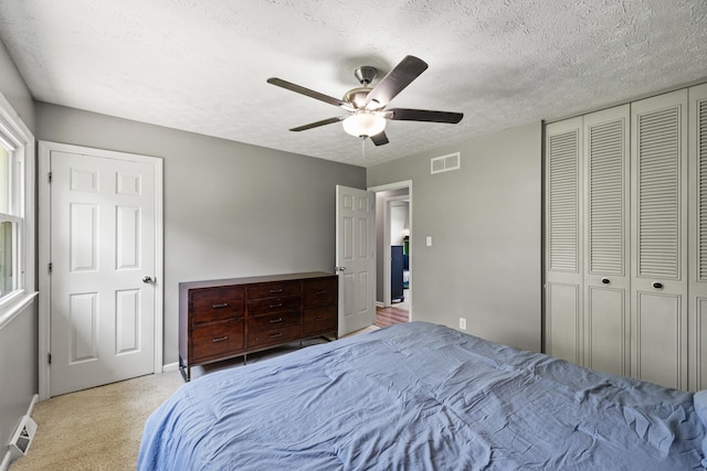 263 S Eagle Creek Dr, Lexington, KY 40515 - carpeted bedroom featuring a textured ceiling, ceiling fan, baseboards, a closet, and multiple windows