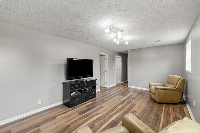 263 S Eagle Creek Dr, Lexington, KY 40515 - living area featuring wood finished floors, baseboards, and a textured ceiling