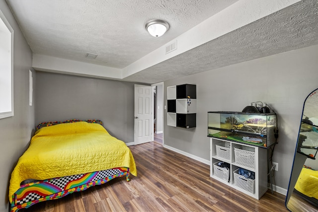 263 S Eagle Creek Dr, Lexington, KY 40515 - bedroom with wood finished floors, a textured ceiling, and baseboards
