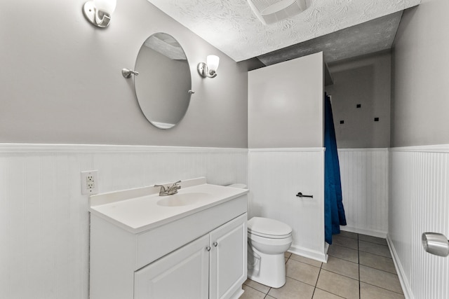 263 S Eagle Creek Dr, Lexington, KY 40515 - bathroom with a wainscoted wall, toilet, vanity, and tile patterned floors