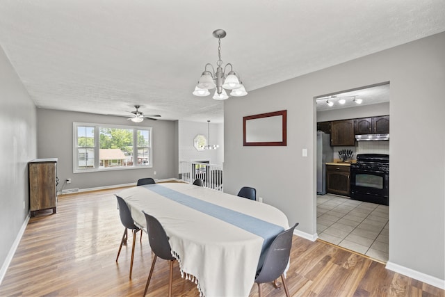 263 S Eagle Creek Dr, Lexington, KY 40515 - dining room featuring a chandelier, light wood-style floors, baseboards, and ceiling fan