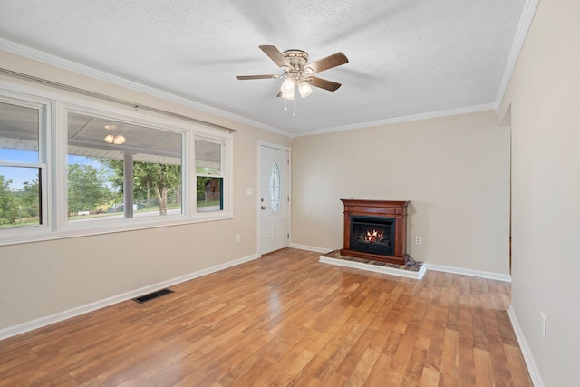 1780 Ballard Rd, Lawrenceburg, KY 40342 - unfurnished living room with plenty of natural light, light wood-type flooring, ornamental molding, a ceiling fan, and a lit fireplace