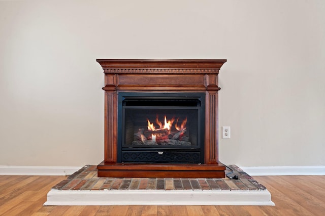 1780 Ballard Rd, Lawrenceburg, KY 40342 - detailed view of wood finished floors and a warm lit fireplace