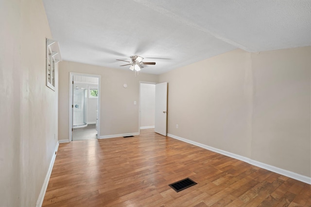 1780 Ballard Rd, Lawrenceburg, KY 40342 - unfurnished room featuring ceiling fan, light wood-style floors, and a textured ceiling