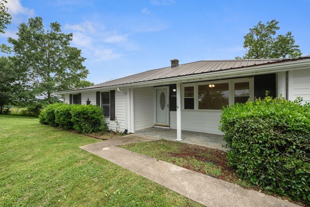 1780 Ballard Rd, Lawrenceburg, KY 40342 - single story home featuring a front yard, a metal roof, and a chimney