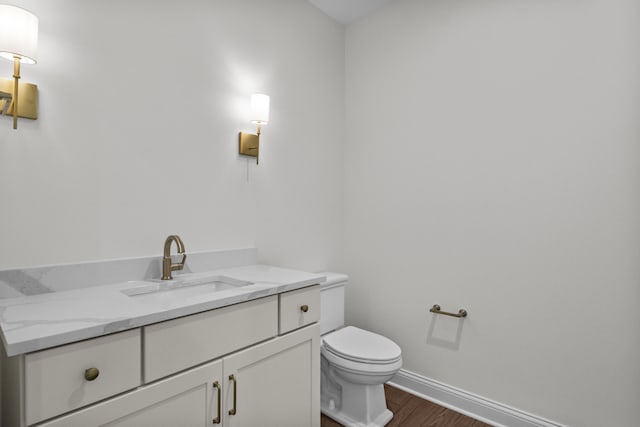 3521 Harper Woods Ln, Lexington, KY 40515 - bathroom featuring wood finished floors, toilet, vanity, and baseboards