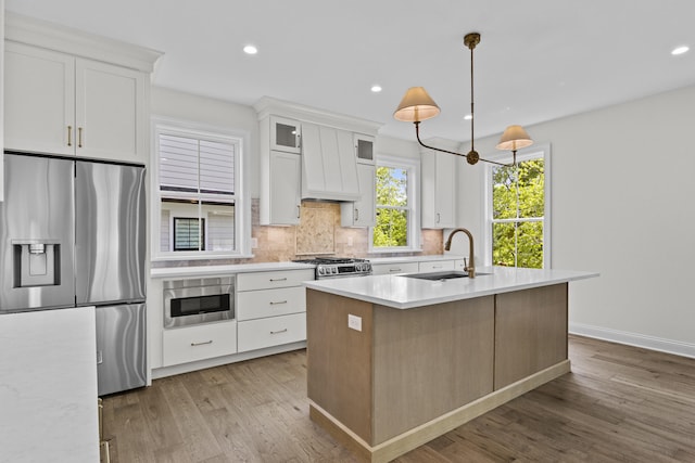 3521 Harper Woods Ln, Lexington, KY 40515 - kitchen with stainless steel appliances, a sink, light countertops, wood finished floors, and backsplash