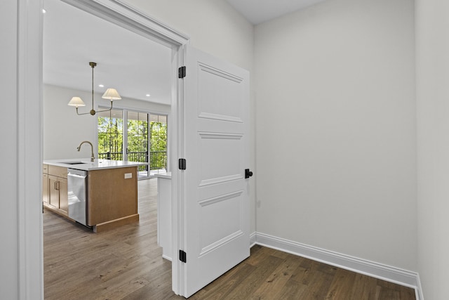 3521 Harper Woods Ln, Lexington, KY 40515 - corridor with a sink, dark wood-style floors, and baseboards
