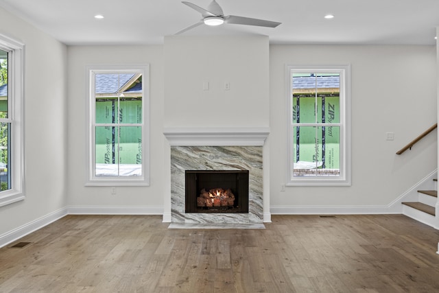 3521 Harper Woods Ln, Lexington, KY 40515 - unfurnished living room with wood finished floors, plenty of natural light, stairway, and recessed lighting