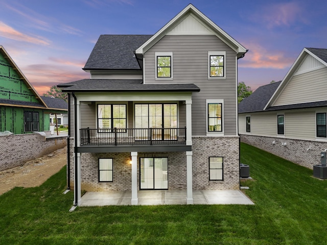 3521 Harper Woods Ln, Lexington, KY 40515 - back of property featuring a patio, central AC unit, brick siding, a yard, and a balcony