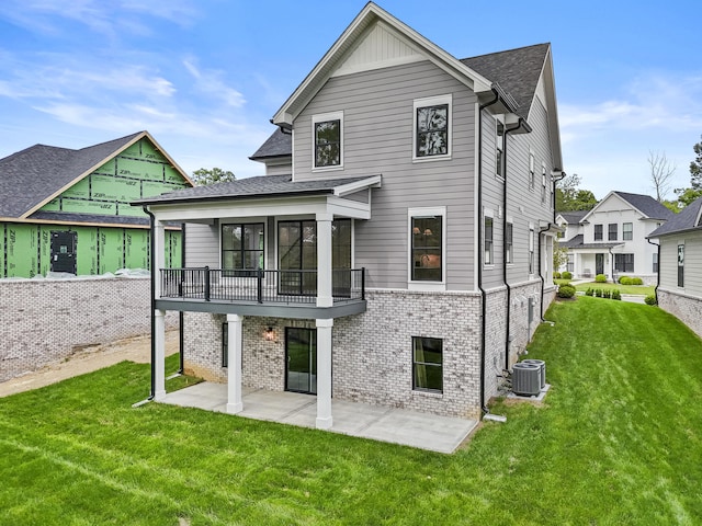 3521 Harper Woods Ln, Lexington, KY 40515 - back of house with central AC unit, brick siding, a patio, and a lawn