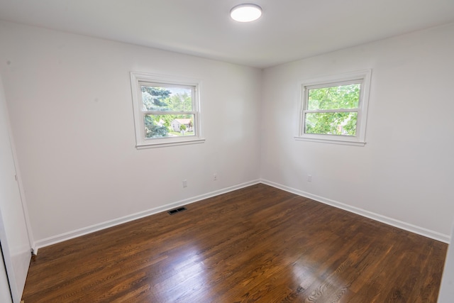 1613 Hastings Ct, Lexington, KY 40505 - spare room with plenty of natural light, dark wood-style flooring, and baseboards