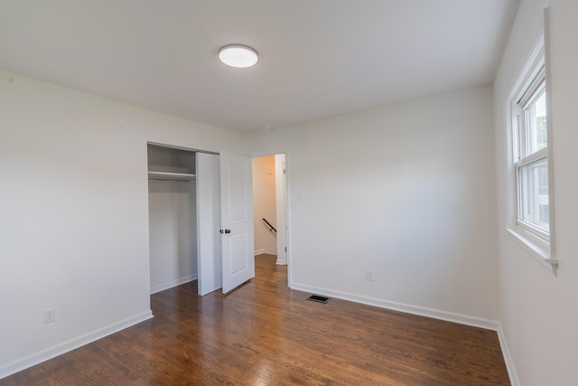 1613 Hastings Ct, Lexington, KY 40505 - unfurnished bedroom with dark wood-type flooring, baseboards, and a closet