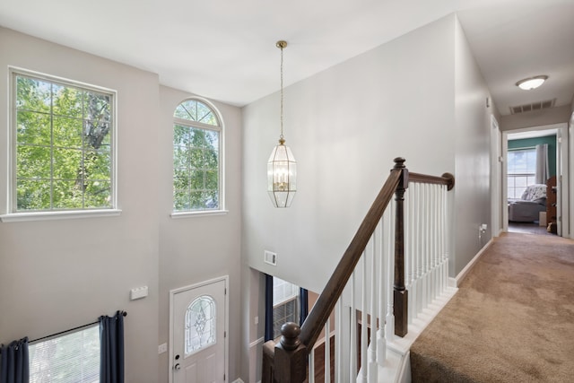 1748 Chandler Ln, Lexington, KY 40504 - entrance foyer with carpet flooring, baseboards, and a chandelier
