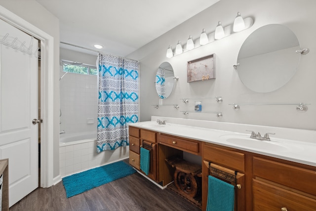 1748 Chandler Ln, Lexington, KY 40504 - full bathroom featuring wood finished floors, double vanity, and tiled shower / bath combo