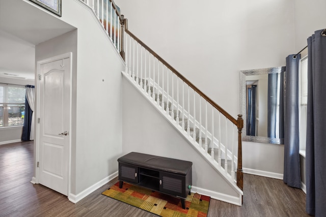 1748 Chandler Ln, Lexington, KY 40504 - entrance foyer with wood finished floors, a towering ceiling, stairs, and baseboards