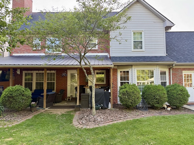 4516 Clubhouse Dr, Lexington, KY 40514 - rear view of property with brick siding, a lawn, a shingled roof, and covered porch