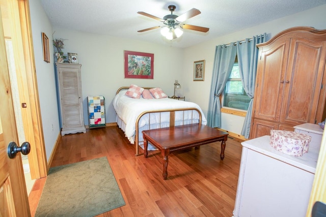 1150 Haynes Knob Rd, Somerset, KY 42501 - bedroom with light wood finished floors, baseboards, and a ceiling fan