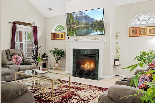 2713 Ella Rae Ct, Lexington, KY 40511 - carpeted living room featuring a premium fireplace, lofted ceiling, plenty of natural light, and baseboards