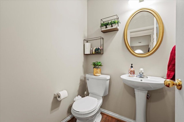 2713 Ella Rae Ct, Lexington, KY 40511 - bathroom featuring toilet, baseboards, and wood finished floors