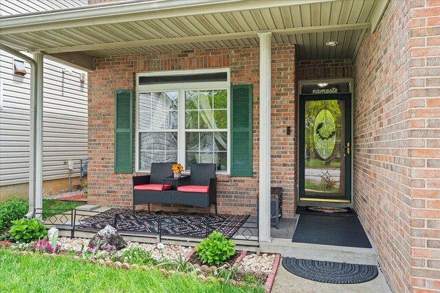 2713 Ella Rae Ct, Lexington, KY 40511 - view of exterior entry with a porch and brick siding