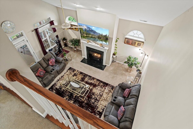 2713 Ella Rae Ct, Lexington, KY 40511 - carpeted living area featuring a fireplace with flush hearth, ceiling fan, high vaulted ceiling, and baseboards