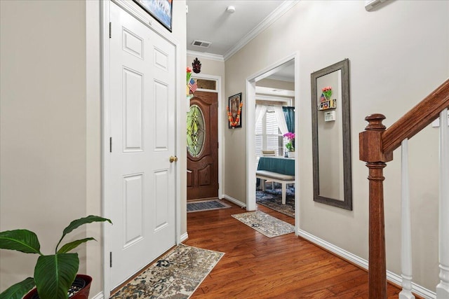2713 Ella Rae Ct, Lexington, KY 40511 - foyer entrance with crown molding, wood finished floors, baseboards, and stairway