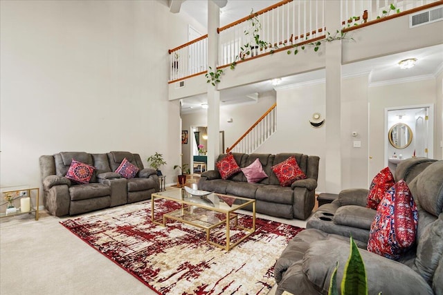 2713 Ella Rae Ct, Lexington, KY 40511 - carpeted living area with a towering ceiling, stairs, and ornamental molding