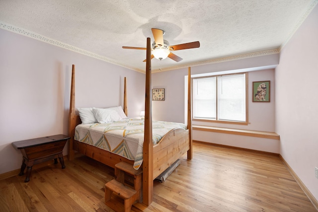 1636 Green Hill Estates Rd, Monticello, KY 42633 - bedroom featuring light wood-type flooring, a textured ceiling, ornamental molding, baseboards, and ceiling fan