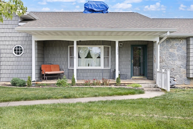 1636 Green Hill Estates Rd, Monticello, KY 42633 - entrance to property with a shingled roof, a porch, a lawn, and stone siding
