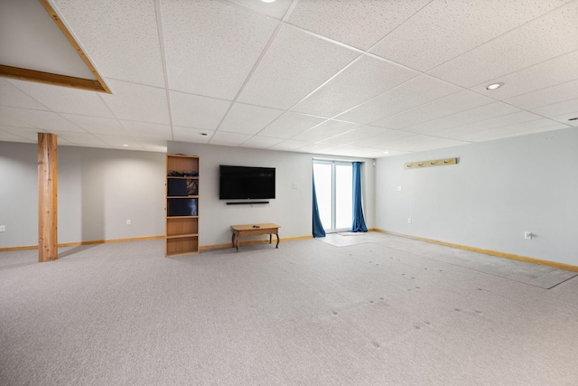 1636 Green Hill Estates Rd, Monticello, KY 42633 - unfurnished living room with baseboards, light colored carpet, a drop ceiling, and recessed lighting