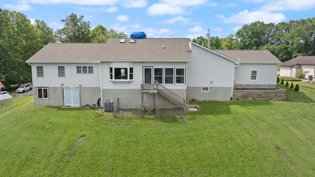 1636 Green Hill Estates Rd, Monticello, KY 42633 - rear view of house with roof with shingles, central air condition unit, and a yard