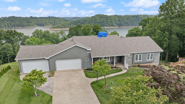1636 Green Hill Estates Rd, Monticello, KY 42633 - single story home featuring a water view, a forest view, an attached garage, driveway, and a front yard