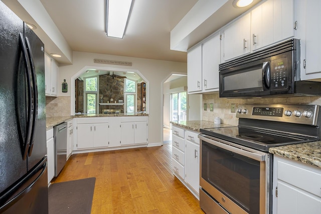 301 Atwood Dr, Lexington, KY 40515 - kitchen featuring black appliances, decorative backsplash, light wood-type flooring, and white cabinetry