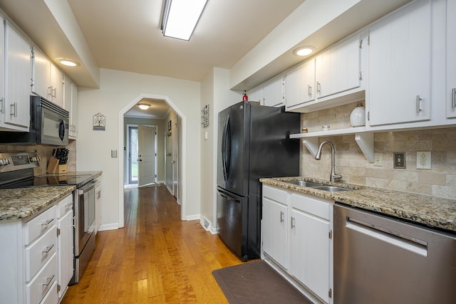 301 Atwood Dr, Lexington, KY 40515 - kitchen with black appliances, a sink, and white cabinetry